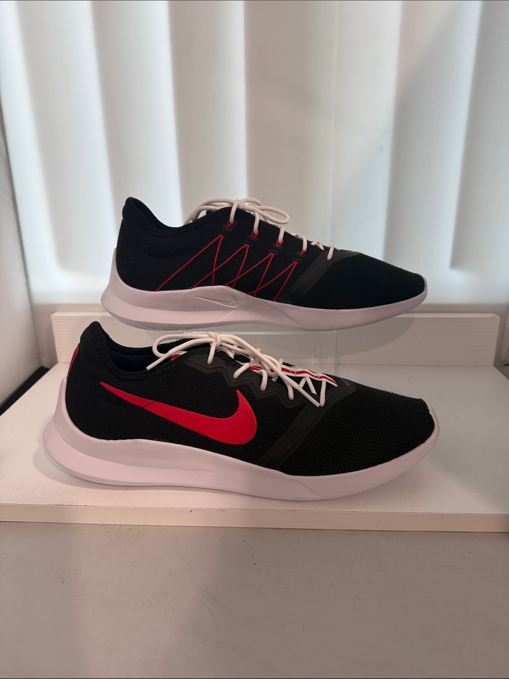 Nike Men's Black Athletic Shoes with Red Swoosh and White Sole